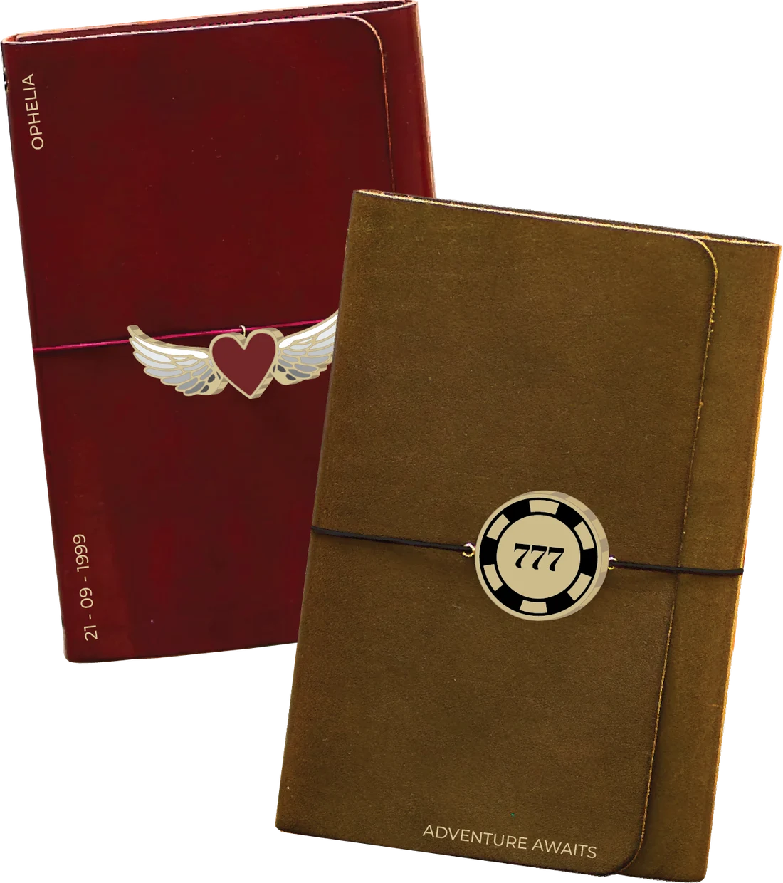 Two Cartelle Companions: an oxblood leather cover embossed OPHELIA with a winged-heart talisman, and a tan suede cover embossed ADVENTURE AWAITS with a 777 chip talisman.